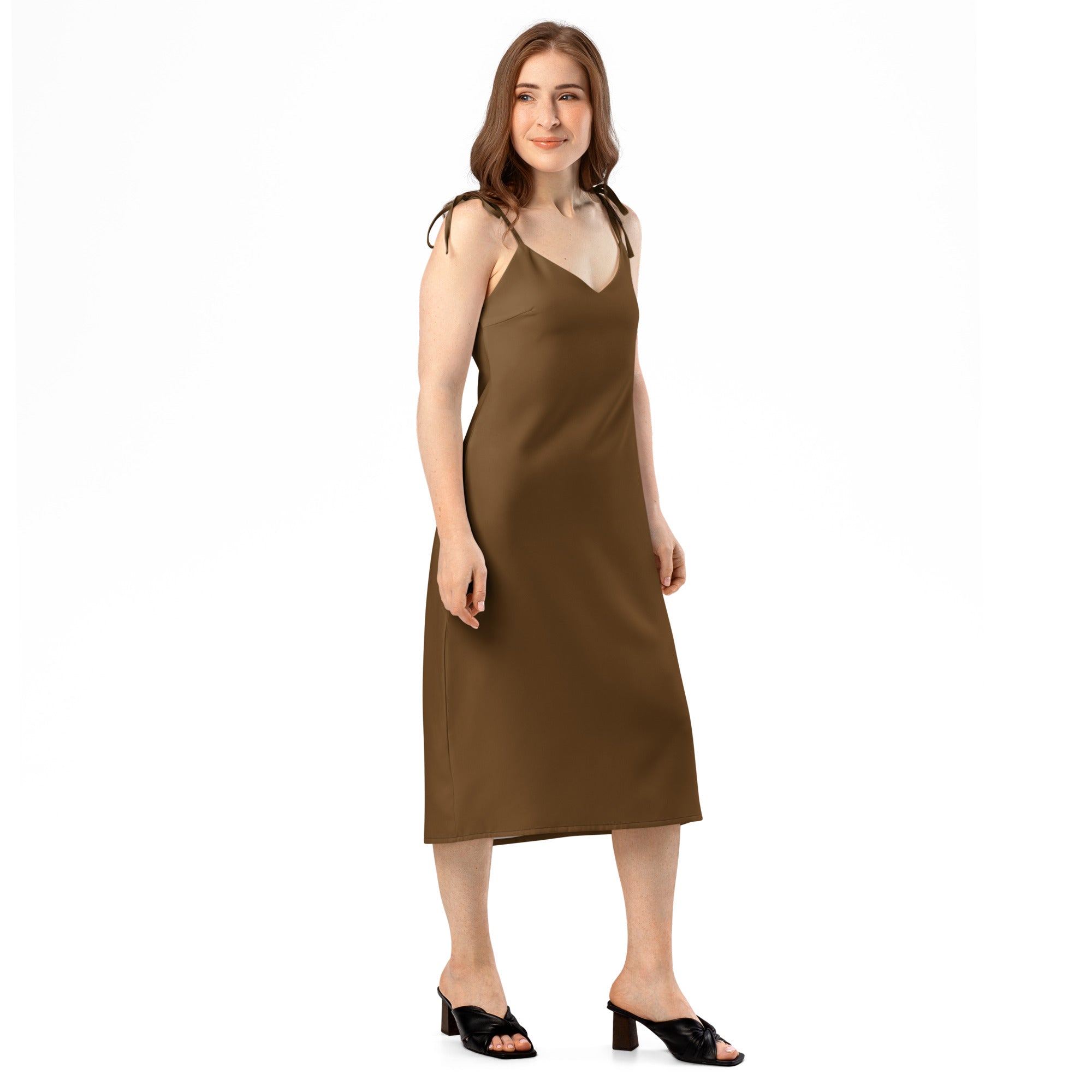 Brown midi slip dress with adjustable tie straps, shown on a model