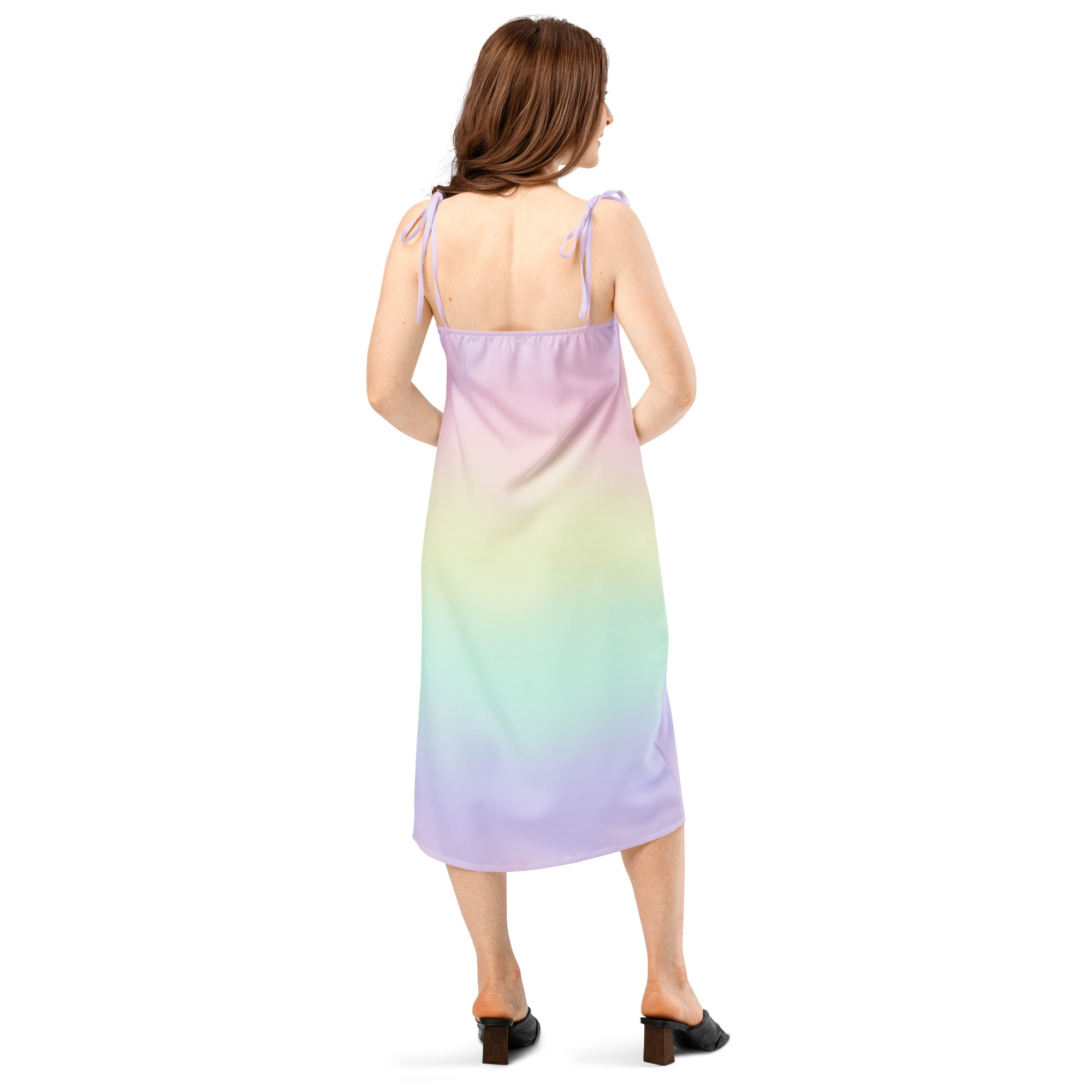 A flowing sleeveless midi dress with adjustable tie straps and built-in bra in a pastel gradient from lavender to mint green