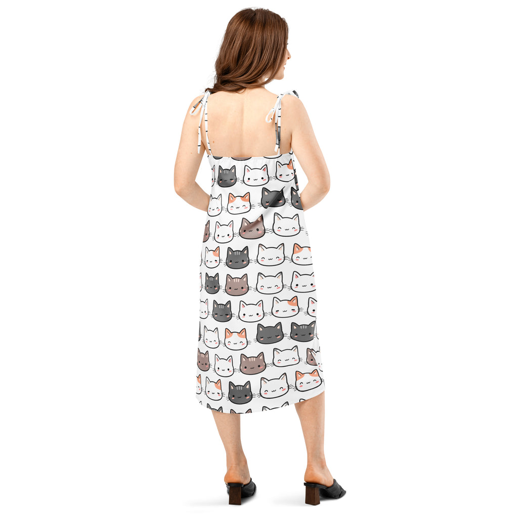 White midi slip dress with adjustable tie straps and built-in bra featuring colorful cartoon cat face pattern