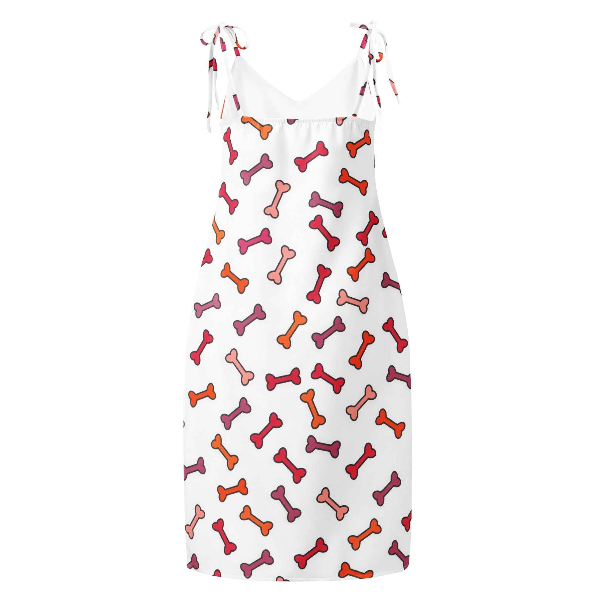 White sleeveless midi slip dress with adjustable tie straps and colorful red orange pink dog bone pattern with built in bra