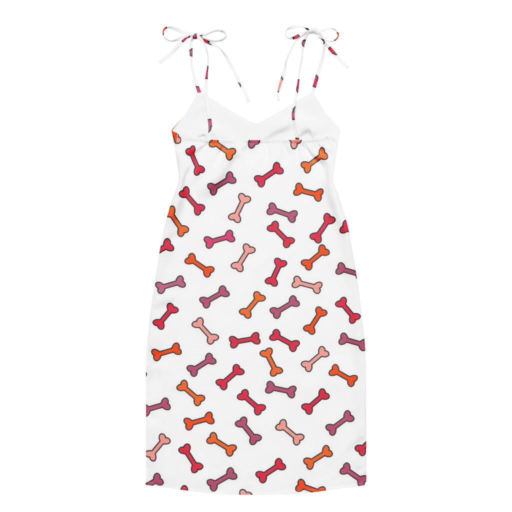Women’s white spaghetti strap midi slip dress with colorful orange red pink dog bone pattern and adjustable tie straps