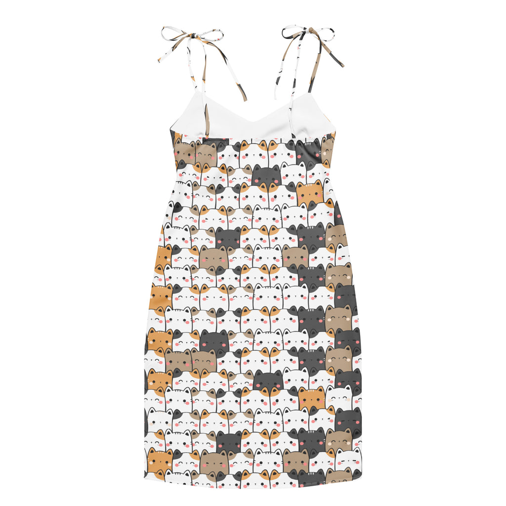 White spaghetti strap midi slip dress with colorful cartoon cats printed featuring adjustable tie straps and built in bra