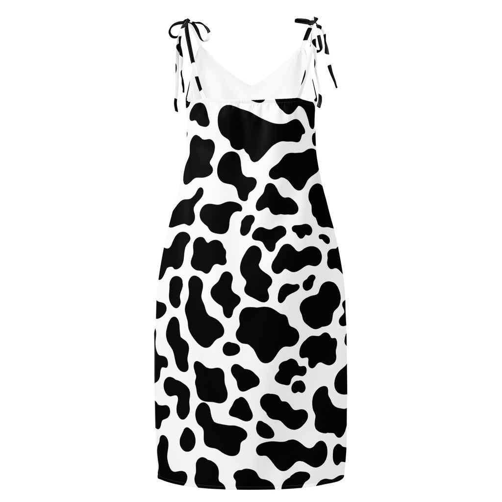 Dress with black and white cow print pattern on a white background