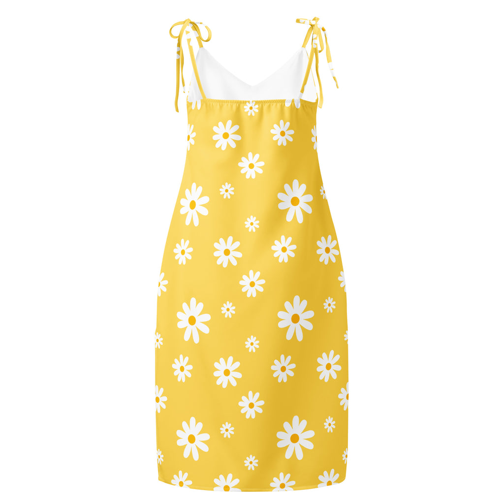 A vibrant yellow women’s midi sundress with white daisy print and adjustable tie straps and built in bra