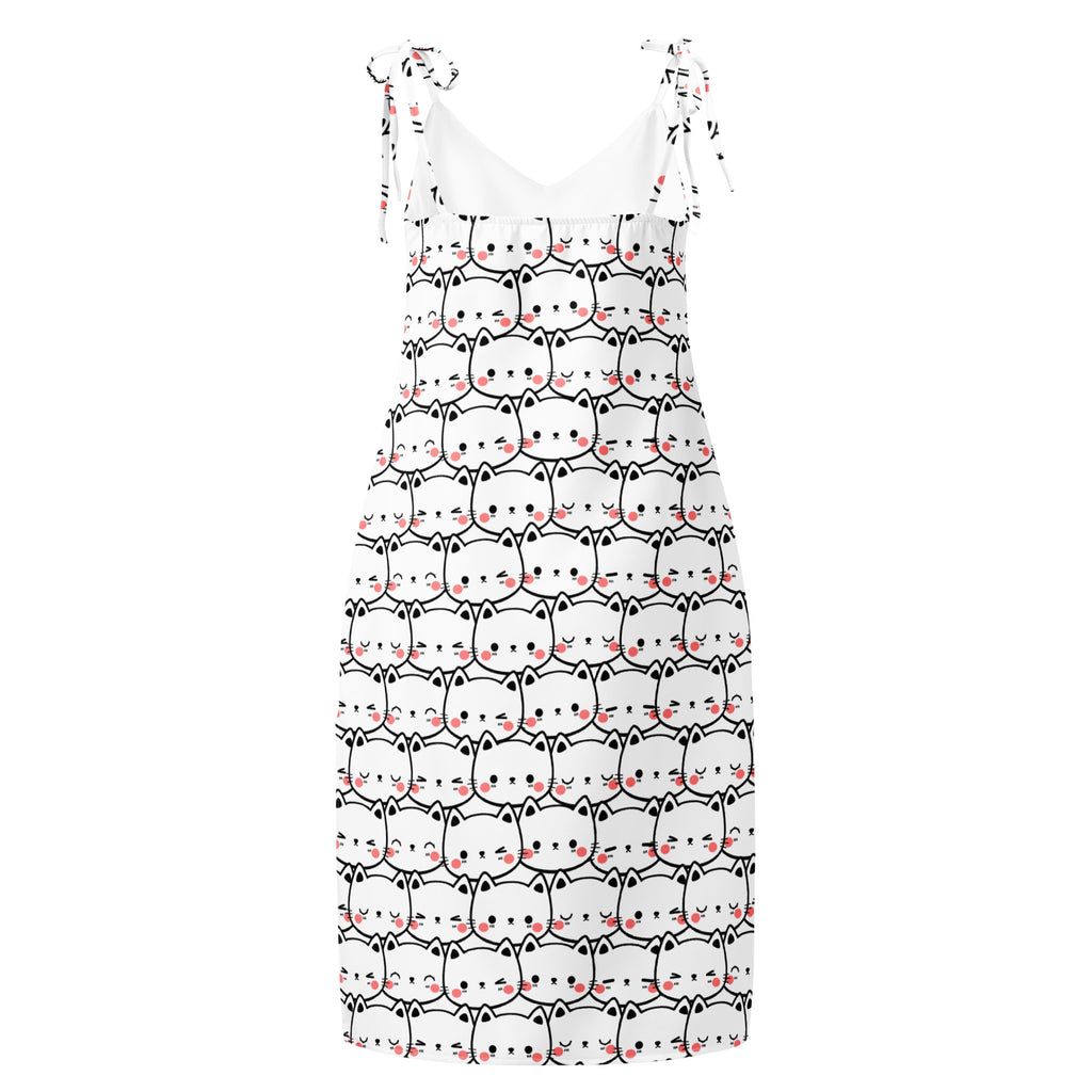 White sleeveless midi slip dress with black and pink cartoon cat faces and adjustable tie straps with built in bra