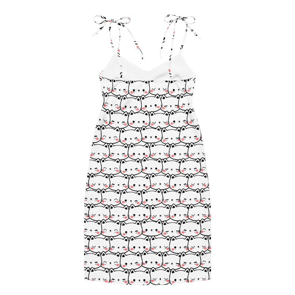 White women’s midi slip dress with adjustable tie straps featuring black outlined cartoon cats with pink cheeks and whiskers