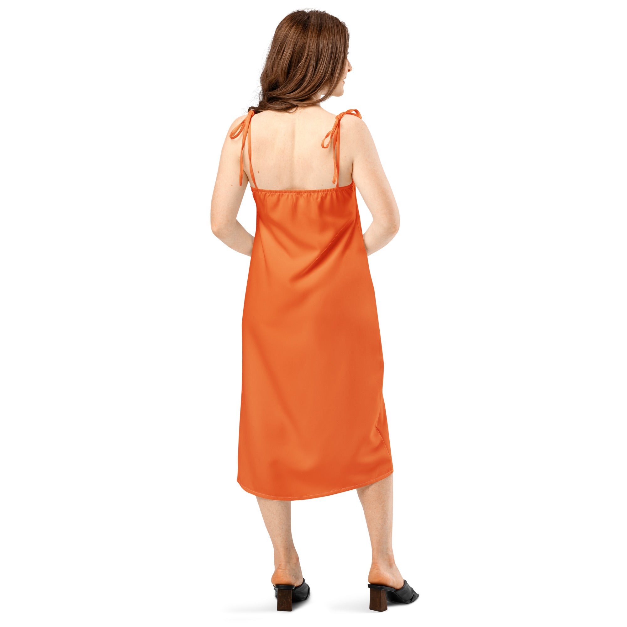 Woman wearing an orange dress on a white background