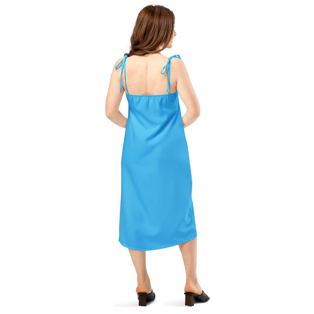 Women's sky blue slip dress with adjustable tie straps and built-in bra, midi length