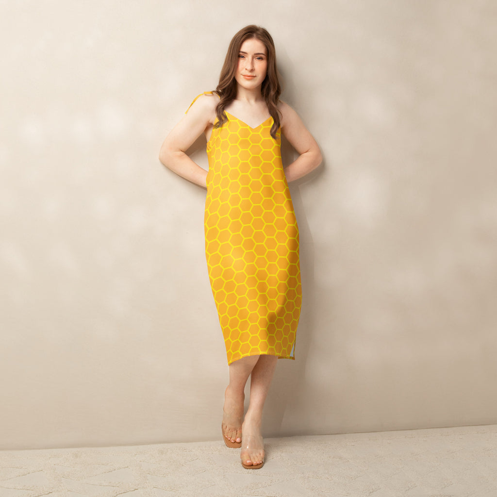 Yellow women’s midi dress with honeycomb pattern lightweight fabric thin straps and v-neckline, front view