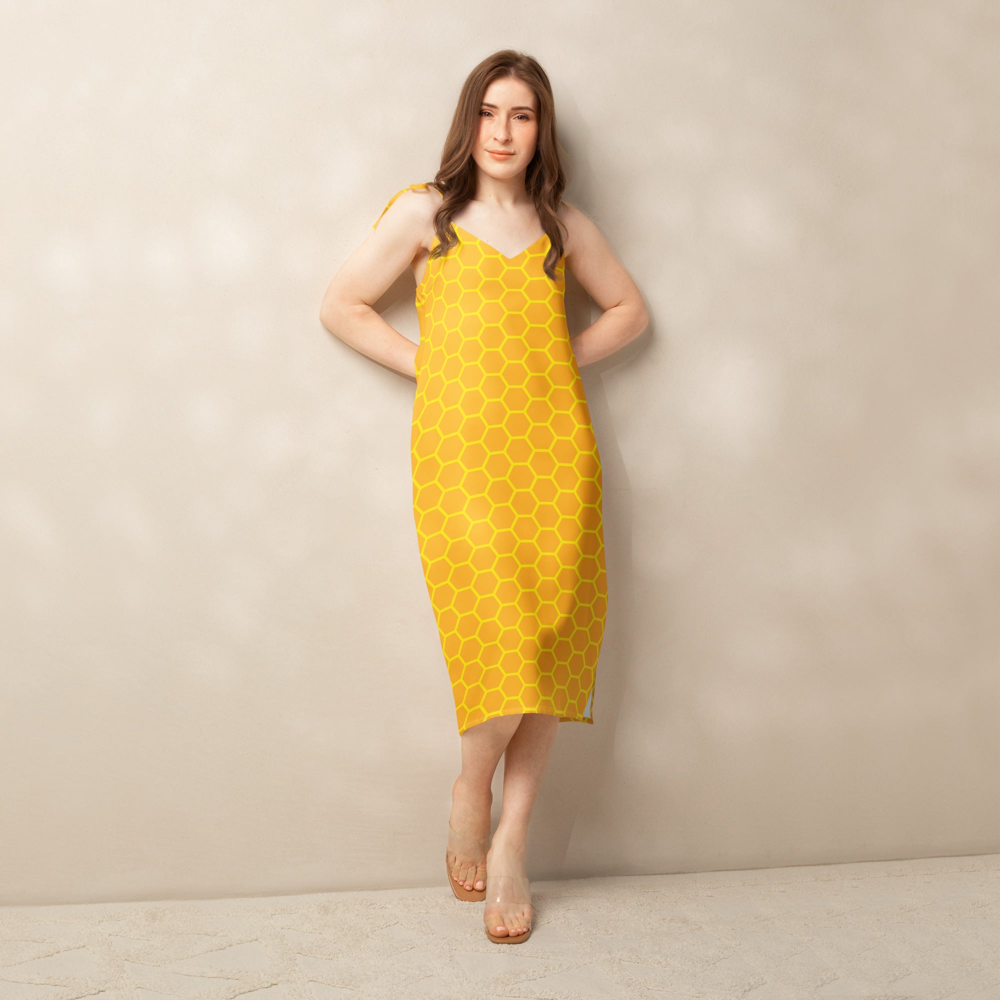 Yellow women’s midi dress with honeycomb pattern lightweight fabric thin straps and v-neckline, front view