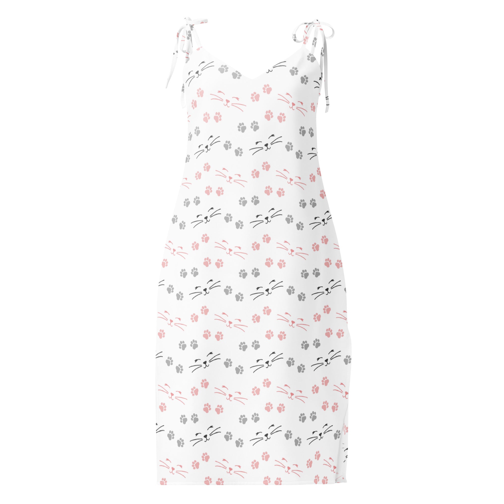 White sleeveless midi slip dress with pink and gray cat face and paw print pattern featuring adjustable tie straps