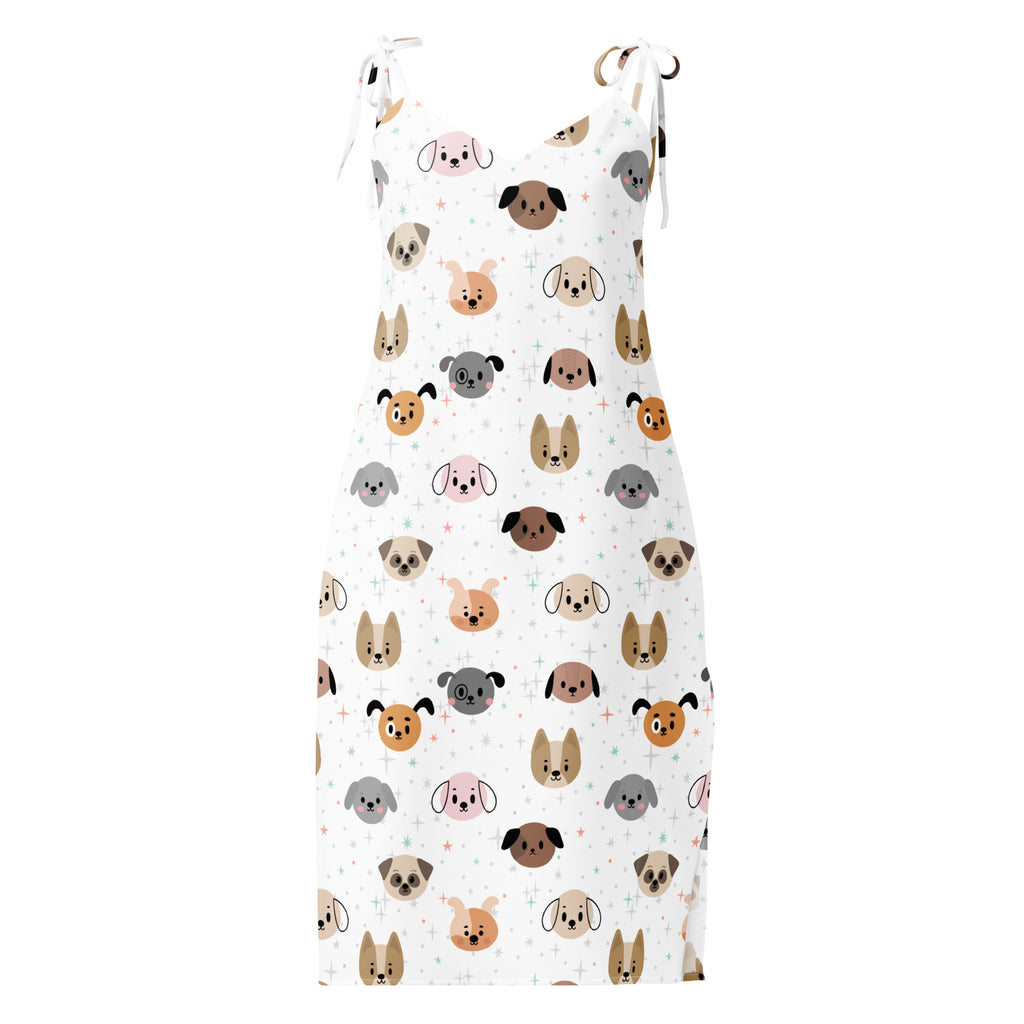 White sleeveless midi dog face slip dress with adjustable tie straps and playful cartoon dog pattern in multiple colors