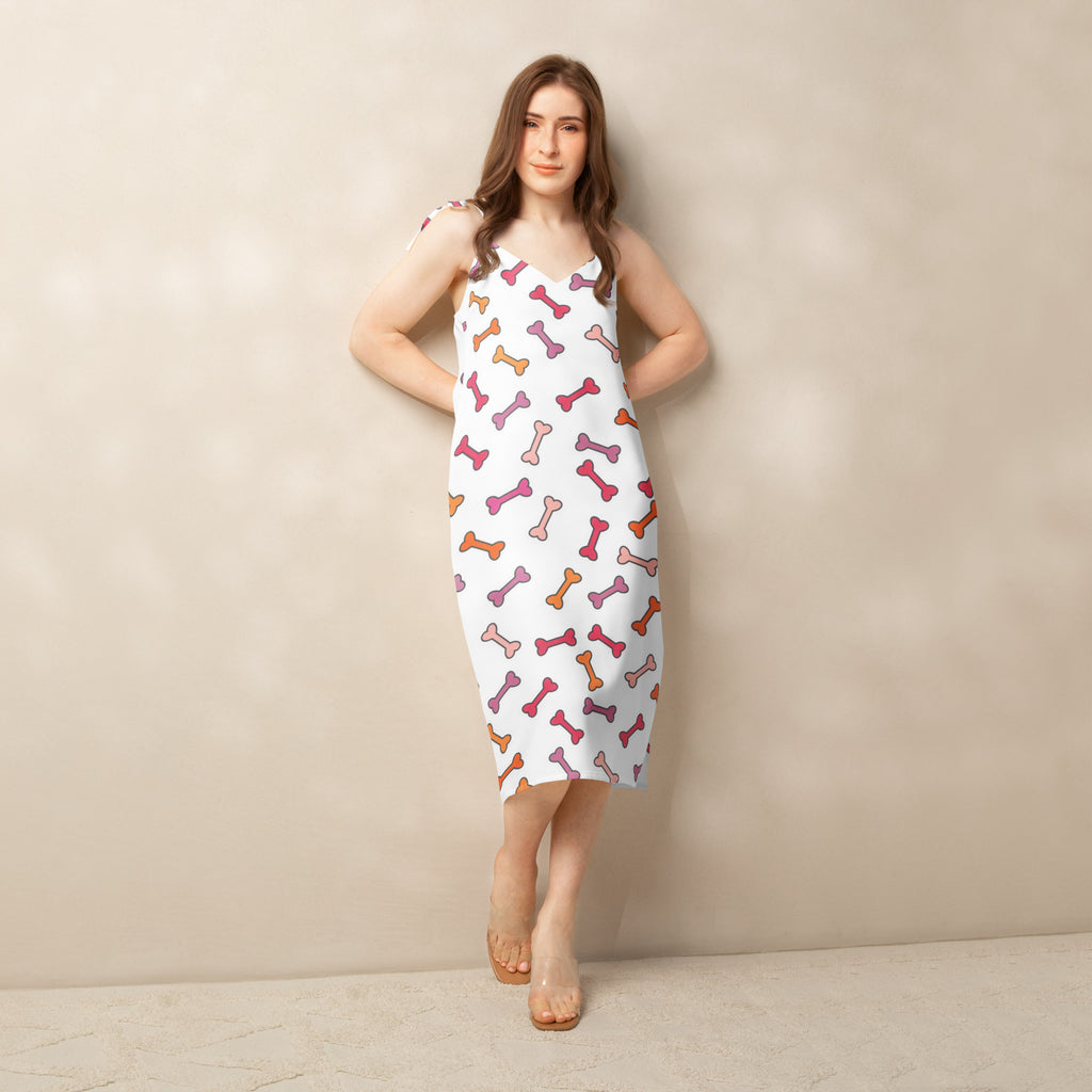 Women’s white sleeveless midi slip dress with colorful dog bone pattern adjustable tie straps and built in bra