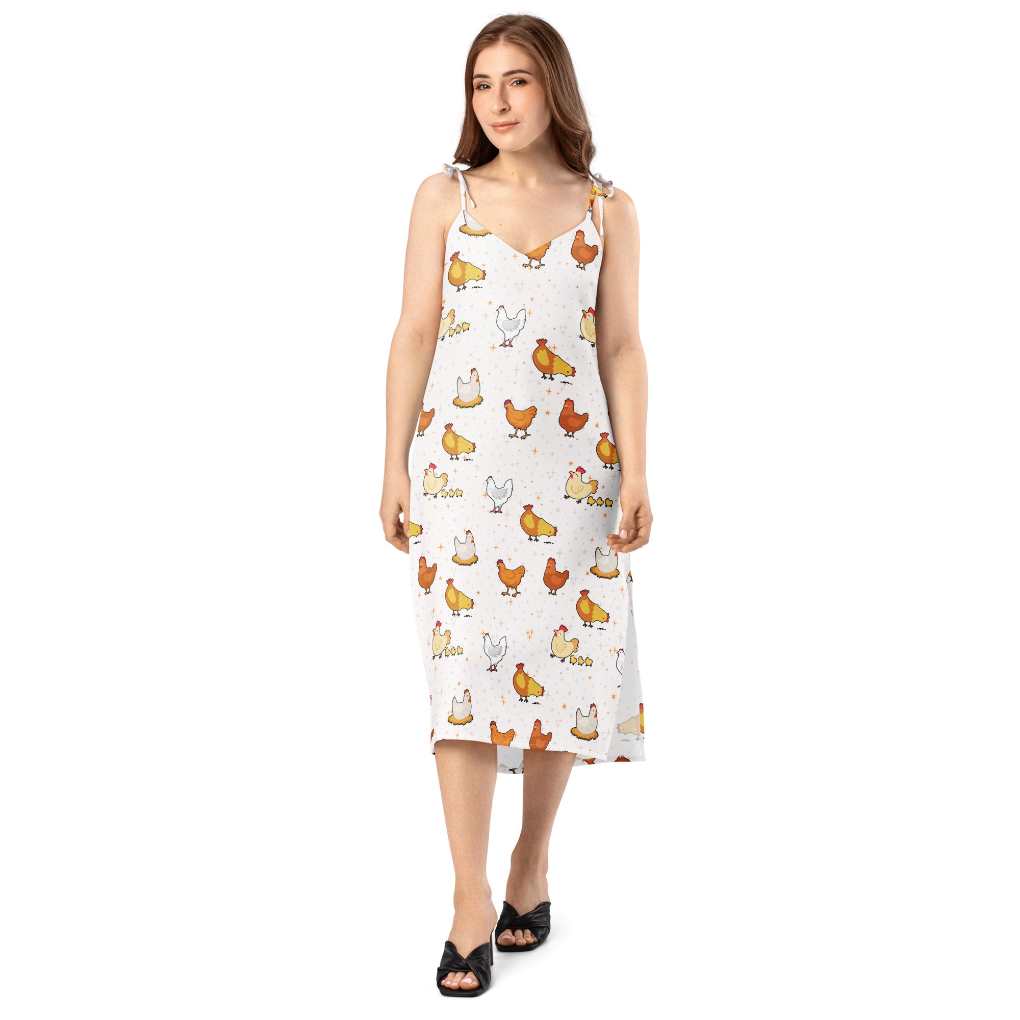 Woman wearing a white dress with chicken pattern on a white background