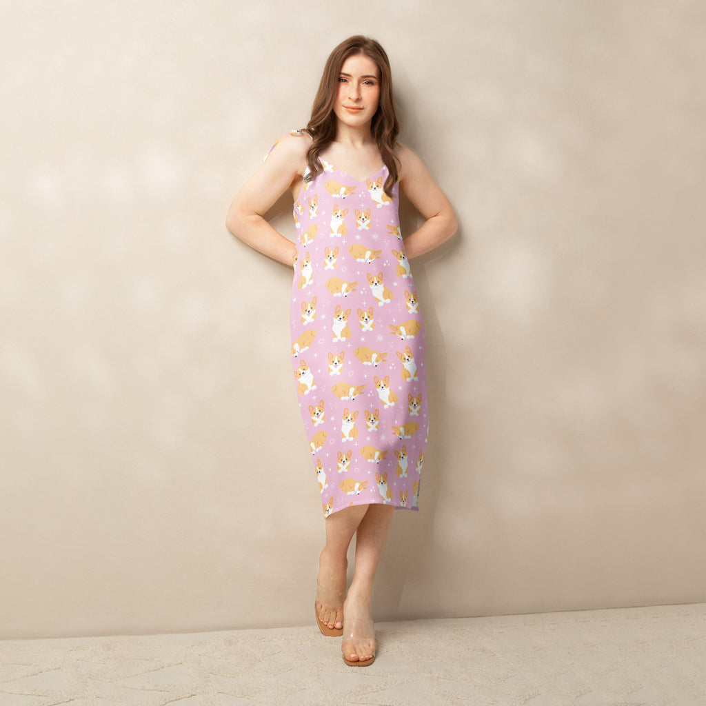 Woman wearing a pink dress with dog pattern against a beige background