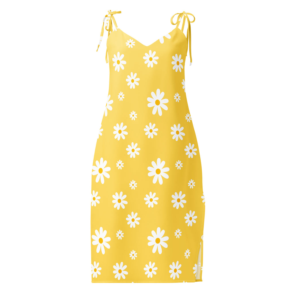A vibrant yellow midi slip dress with white daisy pattern and adjustable tie straps featuring built in bra