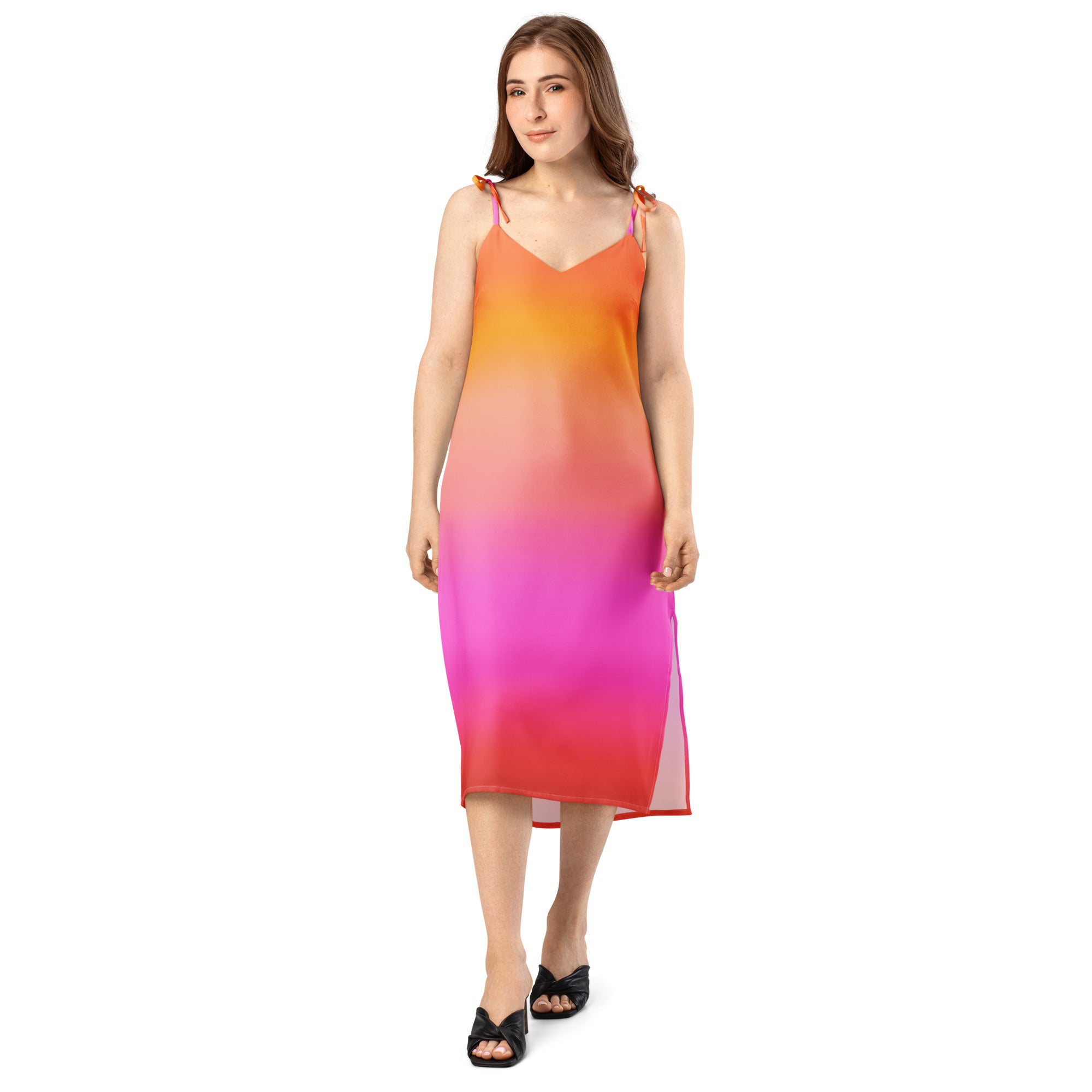 A flowing women’s midi slip dress with adjustable tie straps and built in bra in vibrant sunset ombre hues