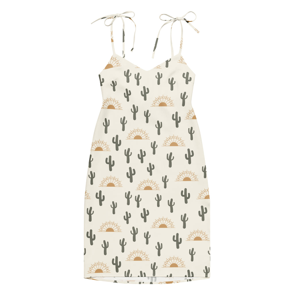Cream-colored women’s desert cactus sunrise slip midi dress with adjustable tie straps and cactus sunburst pattern