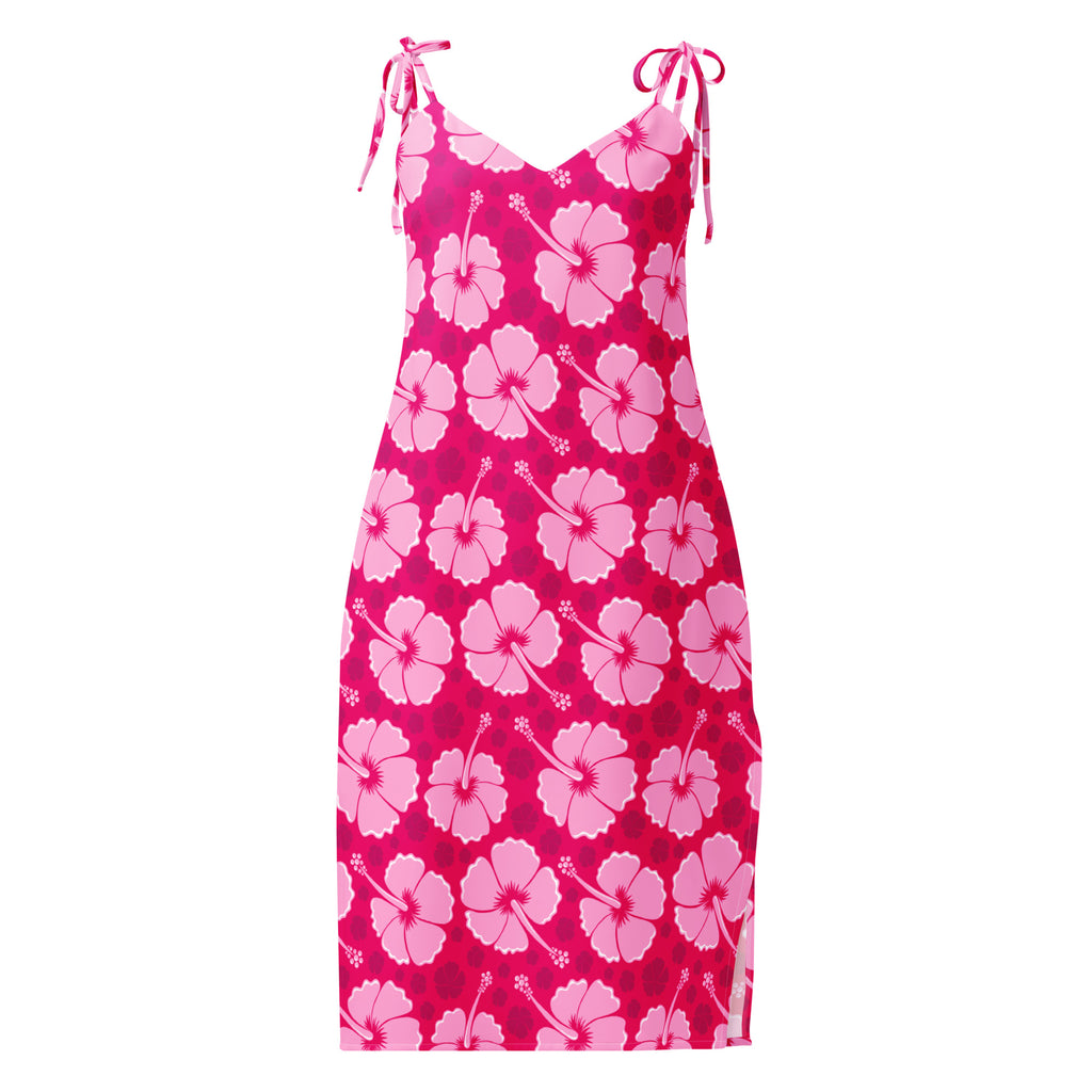 A vibrant pink hibiscus slip dress with adjustable tie straps and side slit perfect for tropical summer wear