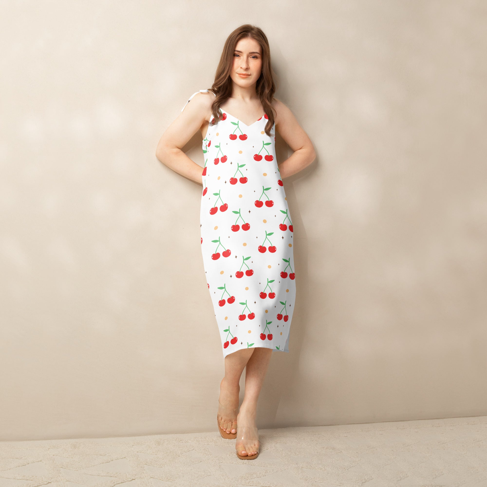 Women’s white cherry print midi slip dress with adjustable tie straps and built in bra with red cherries and green stems