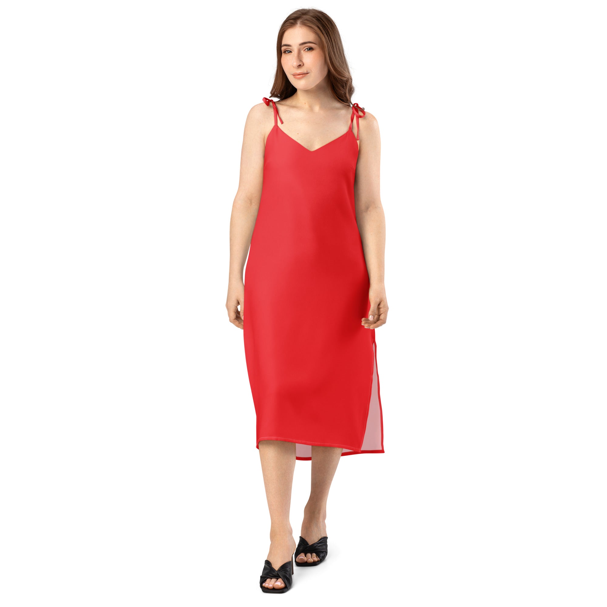 Woman wearing a red slip dress on a white background