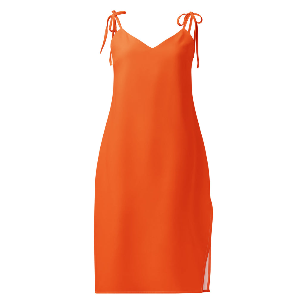 Orange slip dress with thin straps on a white background