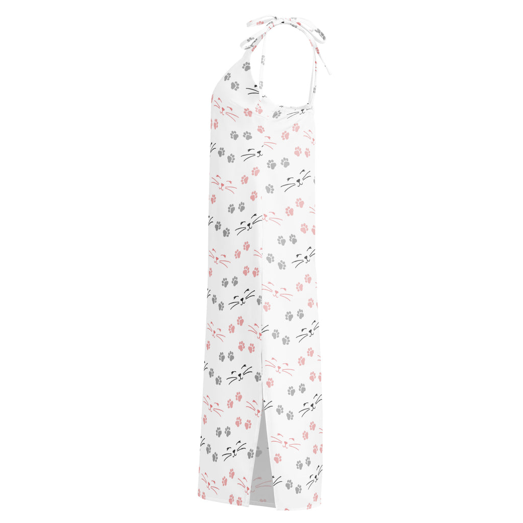 White halter neck maxi dress with pink and gray cat faces and paw prints featuring adjustable tie straps and built in bra