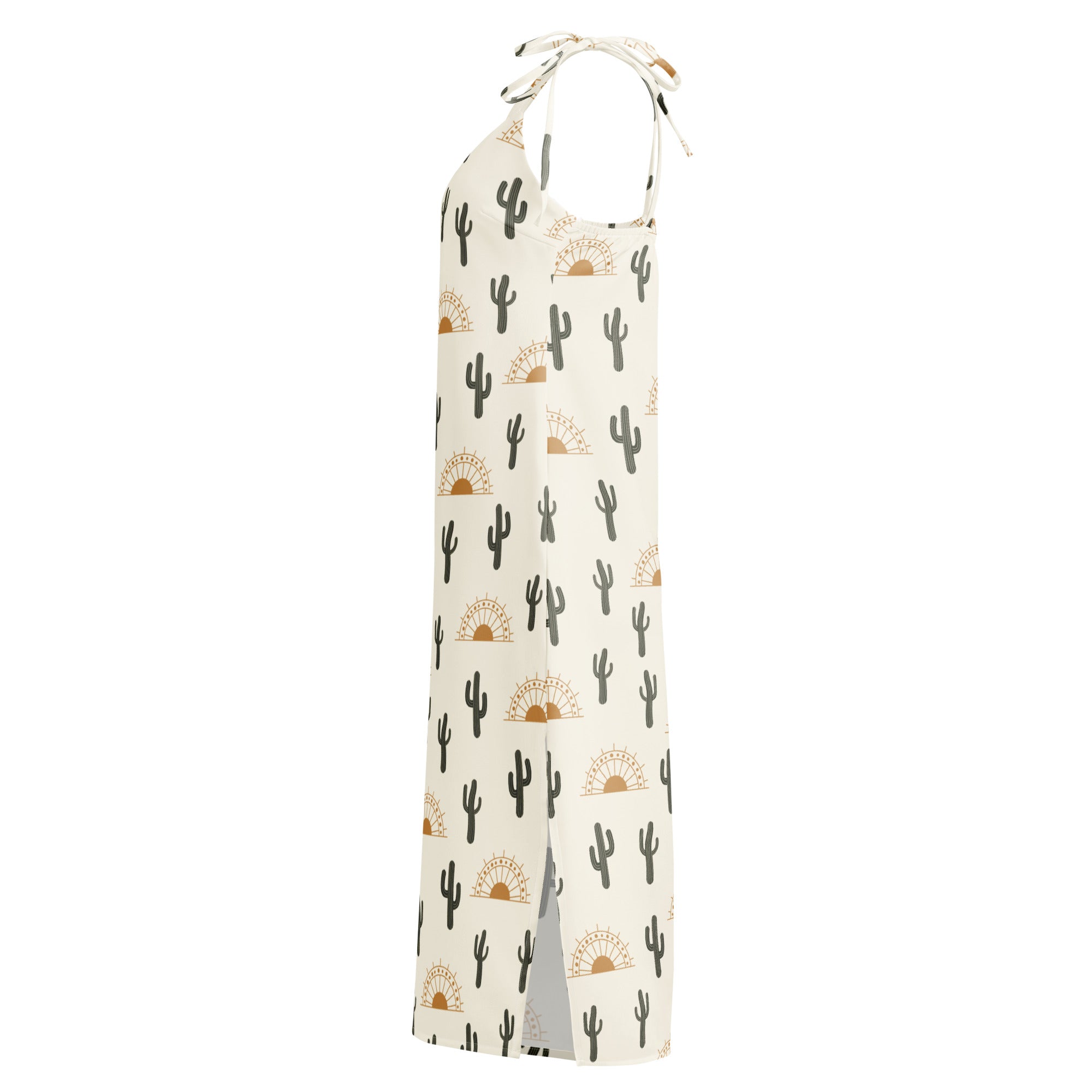 A cream-colored womens desert cactus sunrise midi slip dress with black cacti pattern and adjustable tie straps