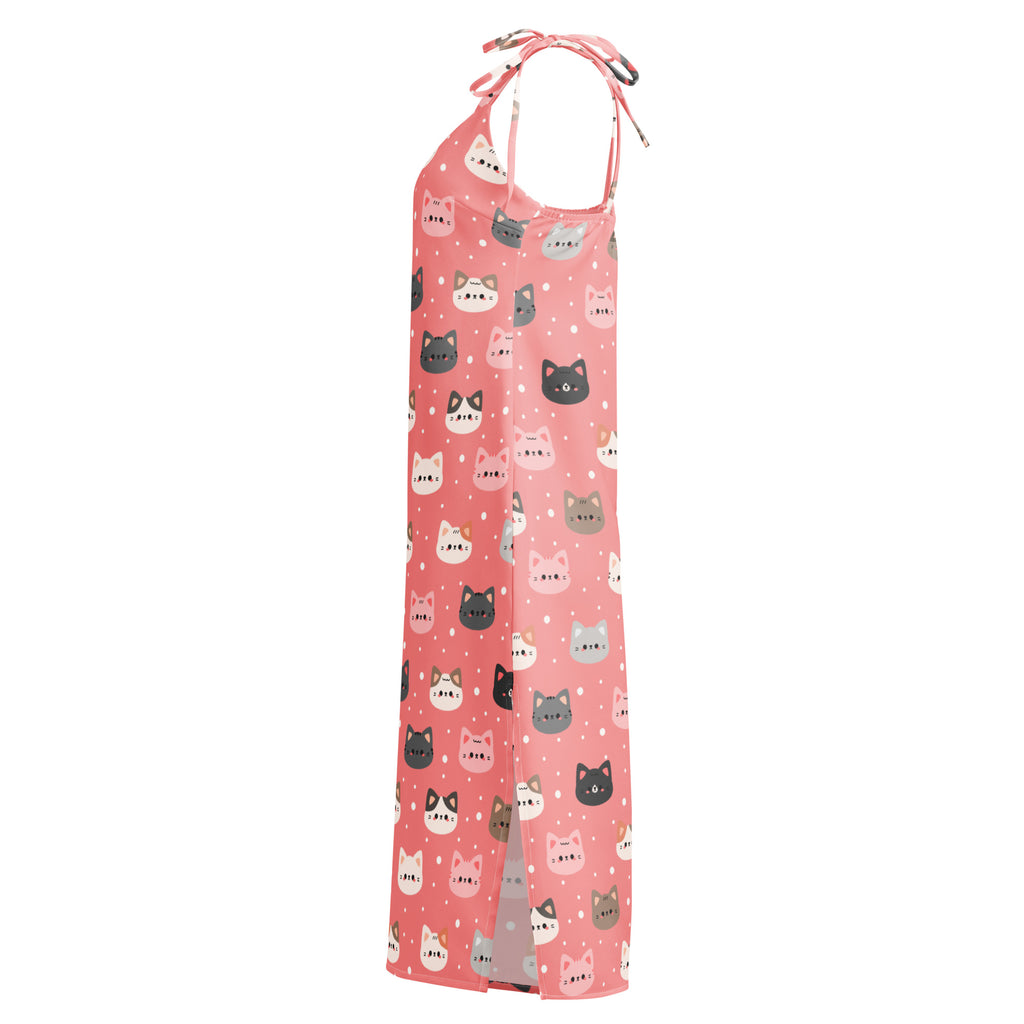 Women’s pink halter-neck maxi dress with adjustable tie straps featuring colorful cartoon cat patterns