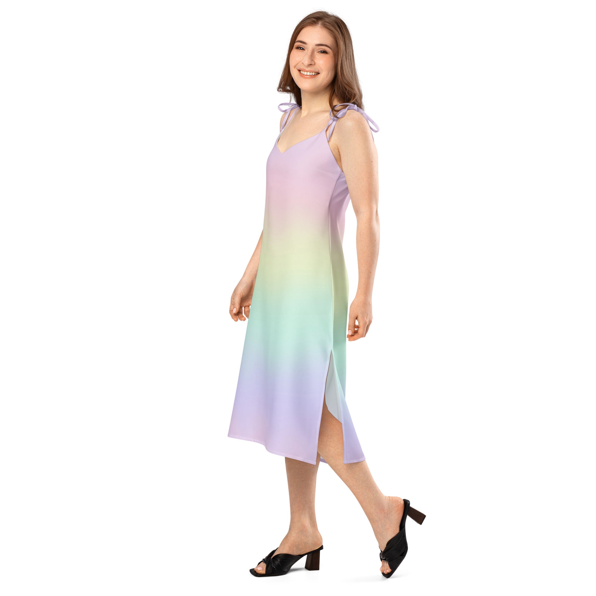 A flowing sleeveless midi dress with lavender to teal gradient fade and adjustable tie straps with built in bra