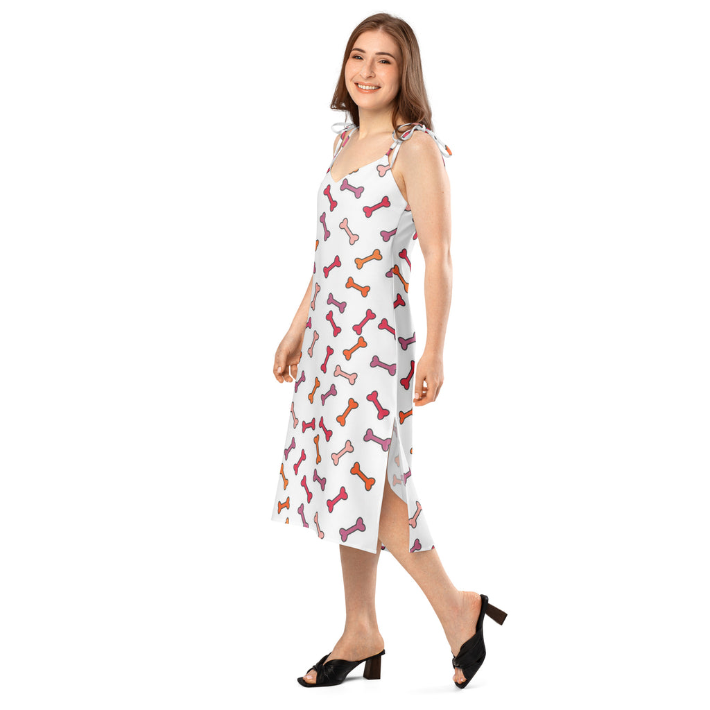 Women’s white sleeveless midi slip dress with adjustable tie-back straps and colorful pink orange purple dog bone pattern