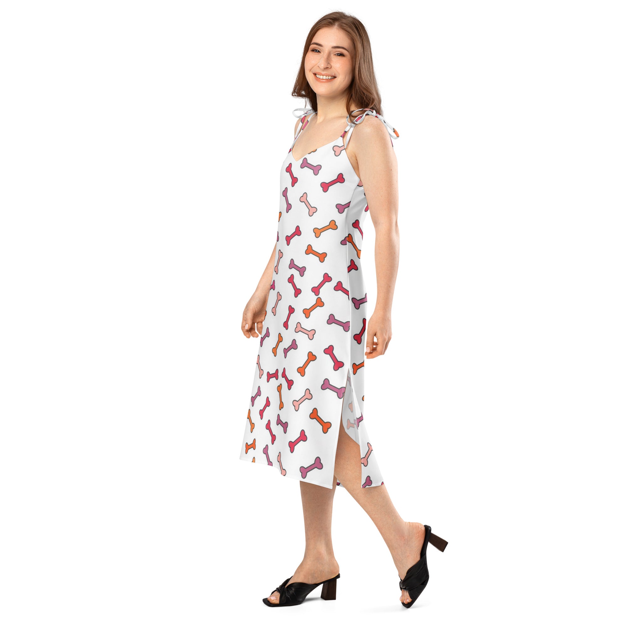 Women’s white sleeveless midi slip dress with adjustable tie-back straps and colorful pink orange purple dog bone pattern