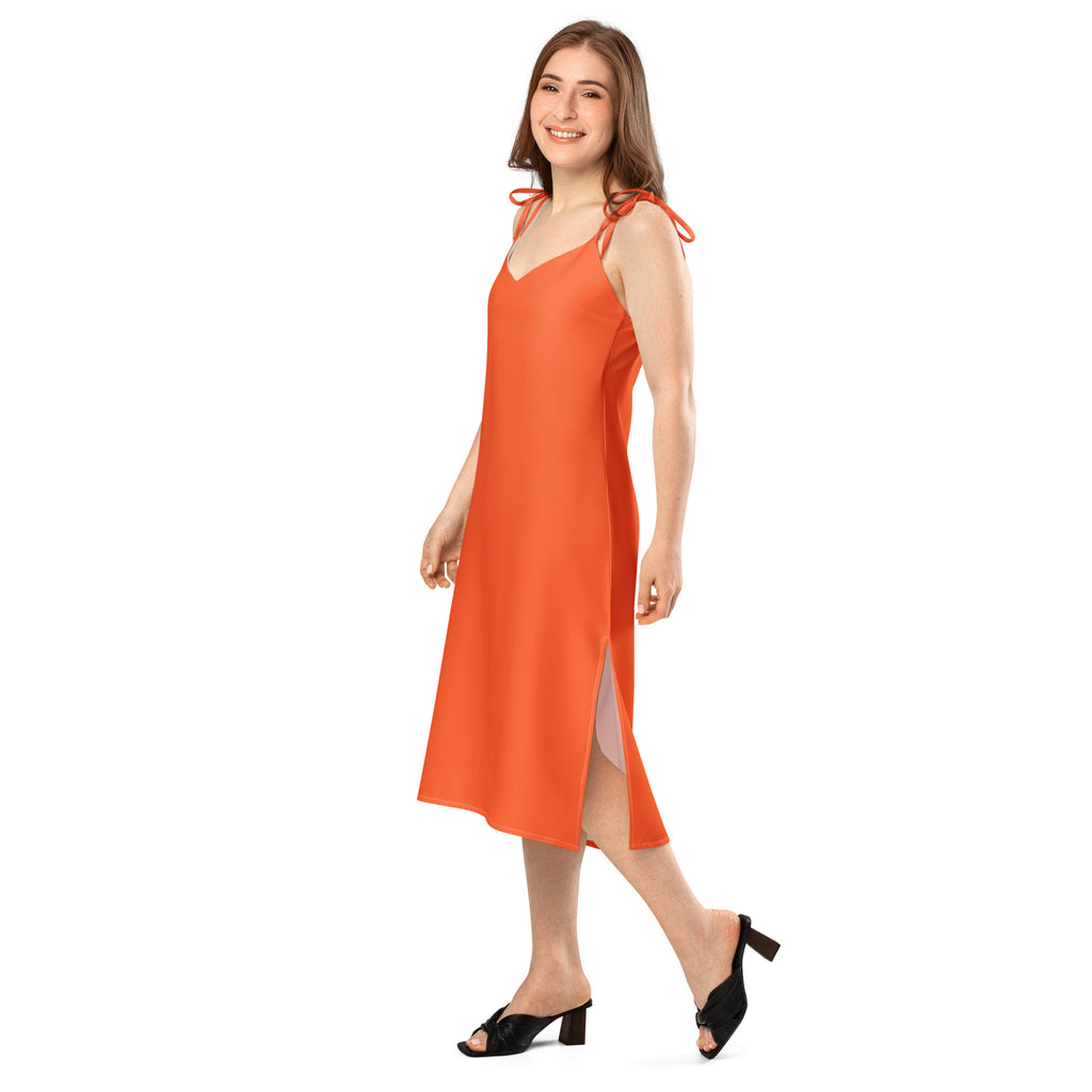 Woman wearing an orange dress on a white background