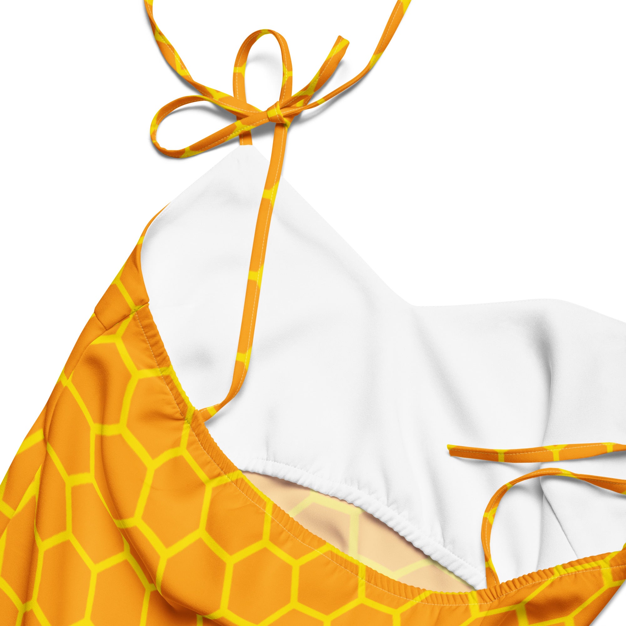 Women’s pink slip midi dress with adjustable tie straps and built in bra paired with vibrant orange yellow honeycomb bikini top