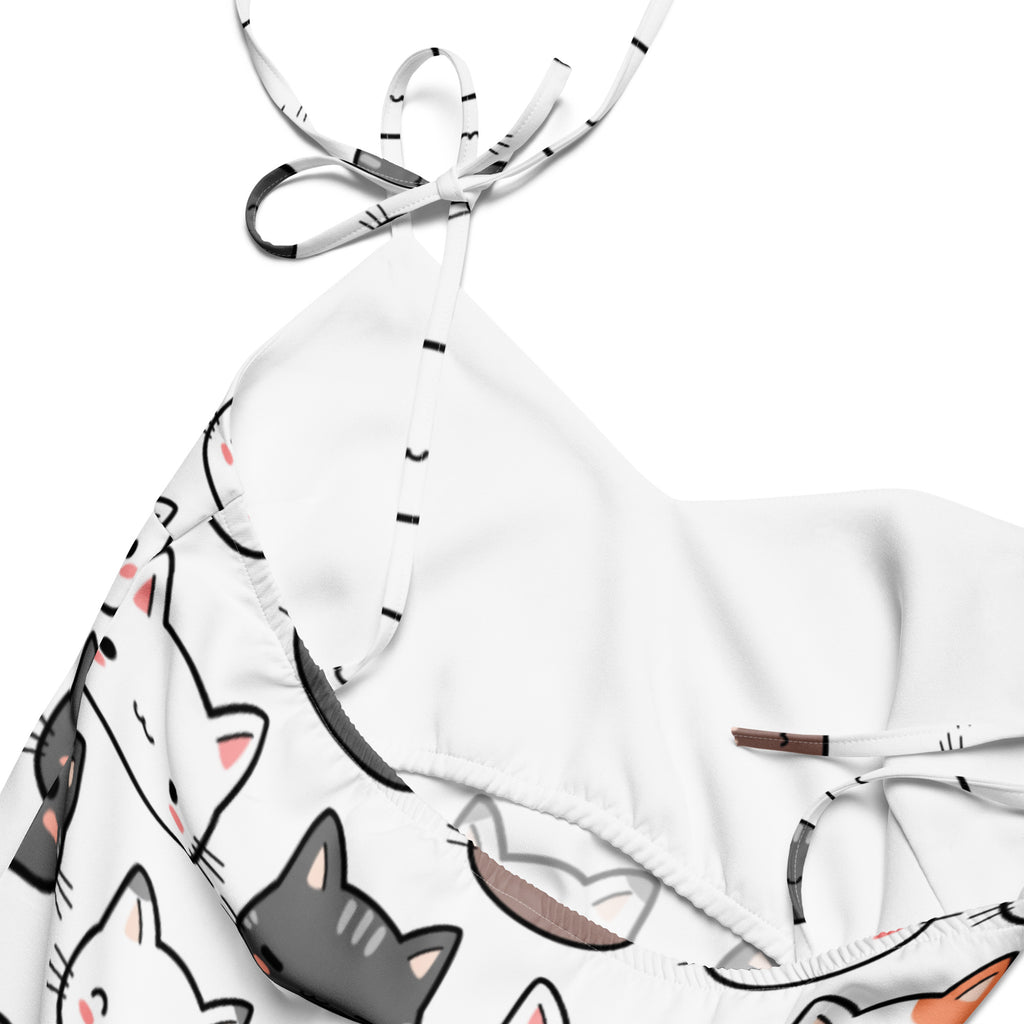 White halter top bikini with playful black gray and pink cartoon cats paired with women’s cat face slip midi dress with adjustable tie straps and built in bra