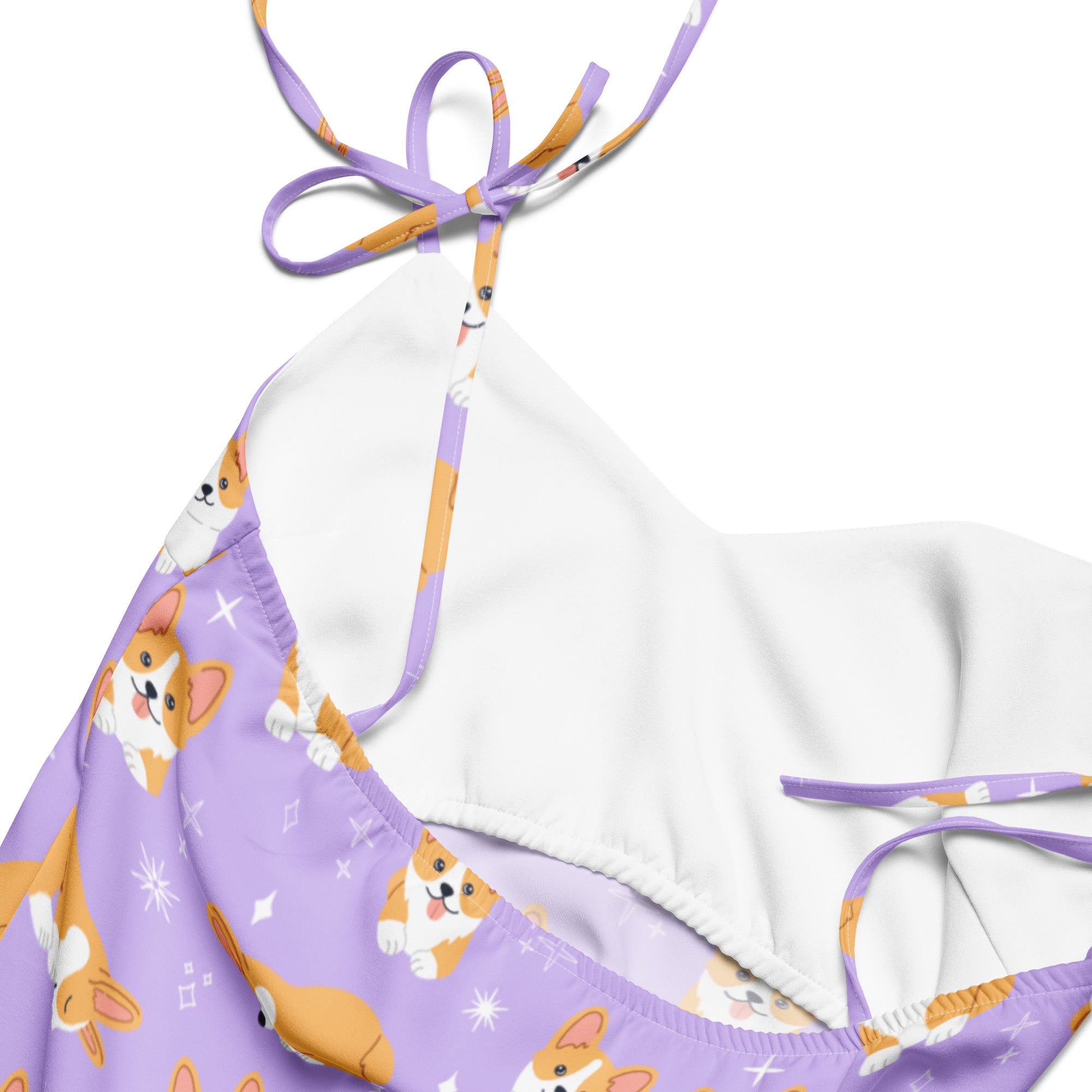 Purple dress with dog pattern and white strap on a white background