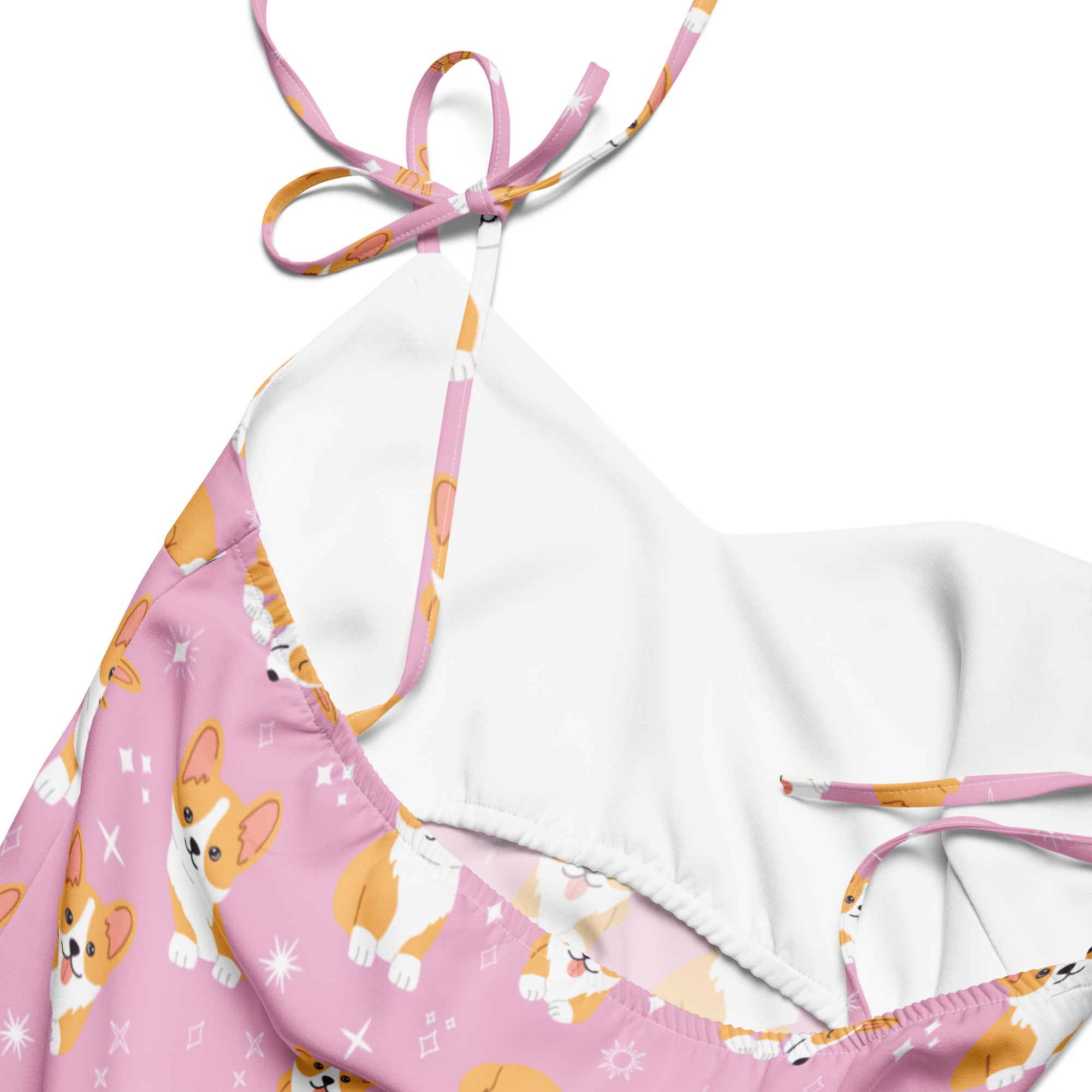 Pink dress with corgi pattern and white strap on a white background