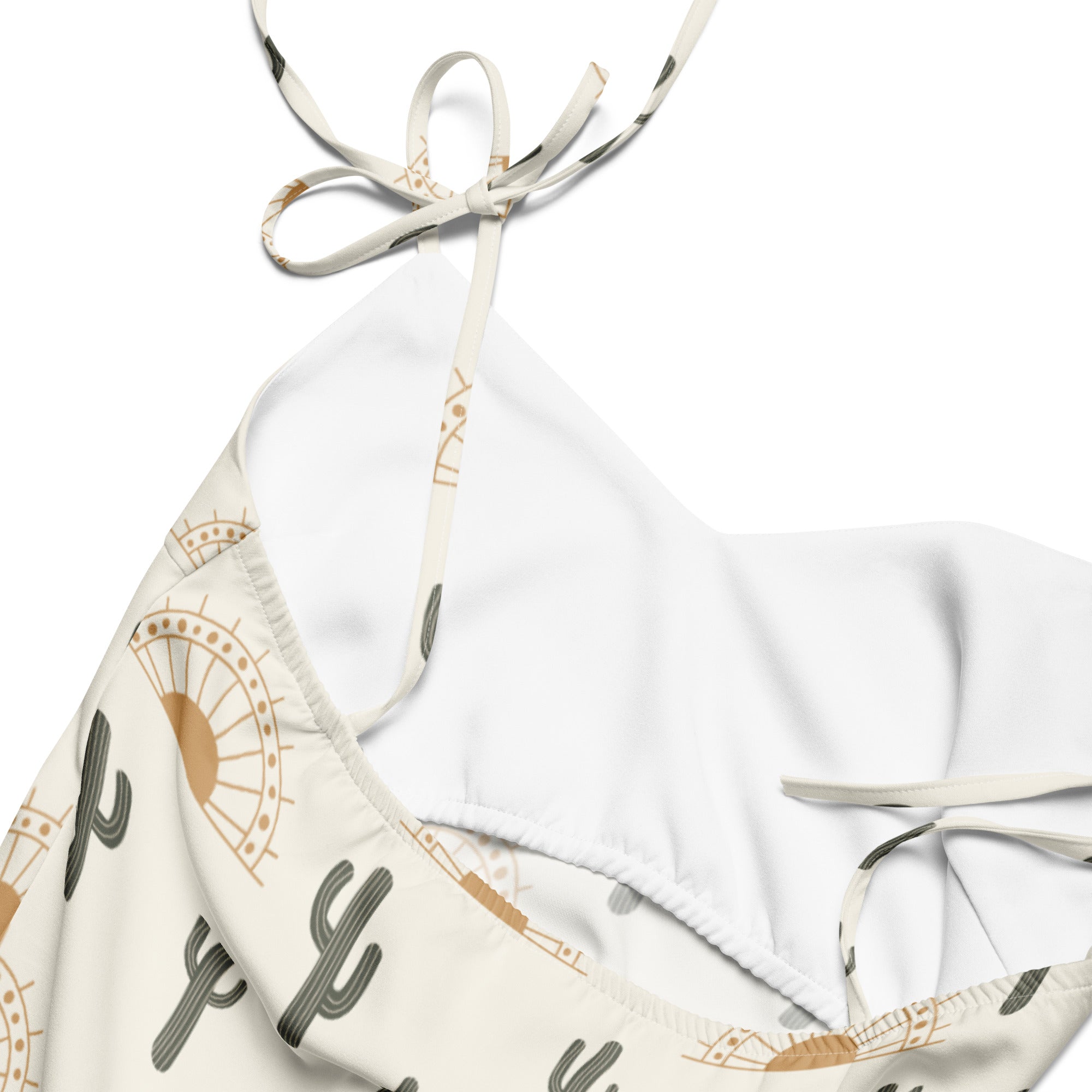 White halter top bikini with gray and tan cactus and sun pattern and adjustable tie straps for women