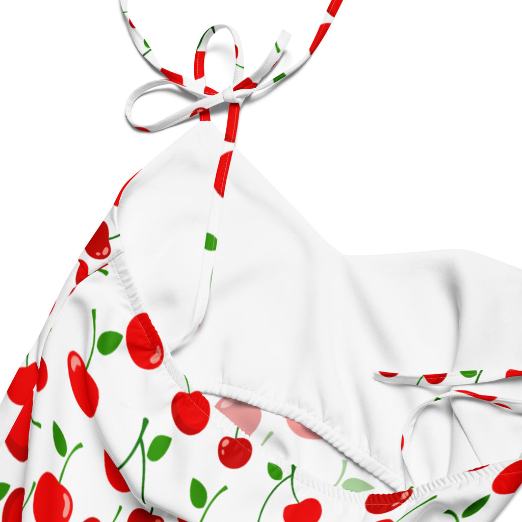 White halter top bikini with red and green cherry print paired with women’s red cherry print midi slip dress with bra