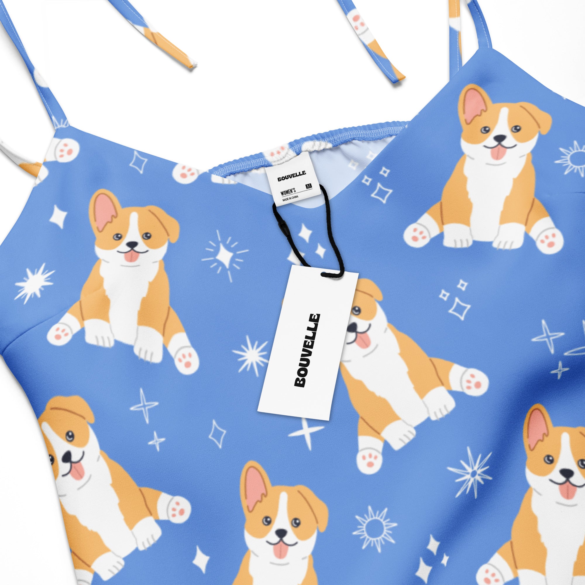 Women’s blue midi slip dress with adjustable tie straps featuring playful orange and white corgi puppy pattern