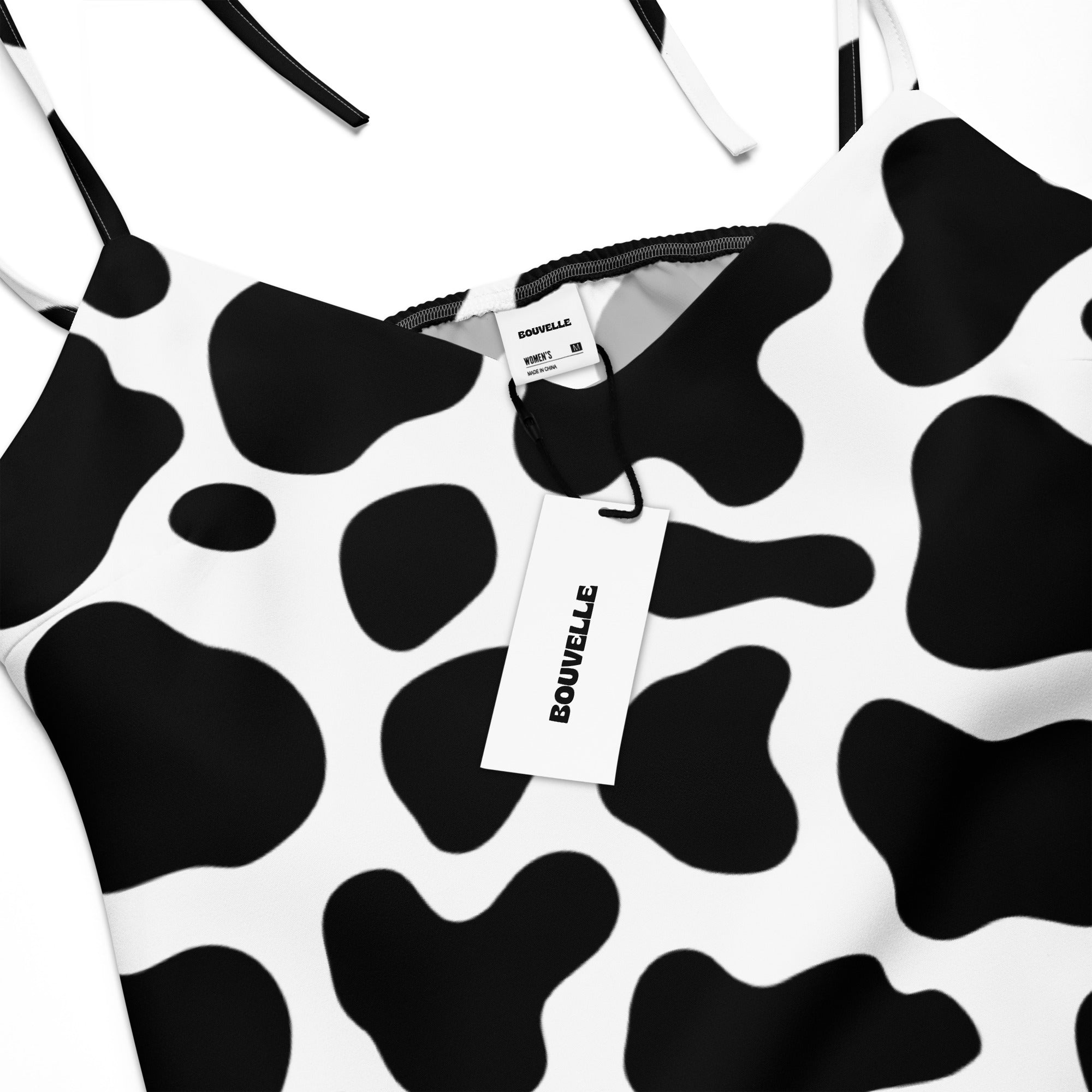 Women’s cow print slip dress midi with adjustable spaghetti straps and built in bra in black and white cow print
