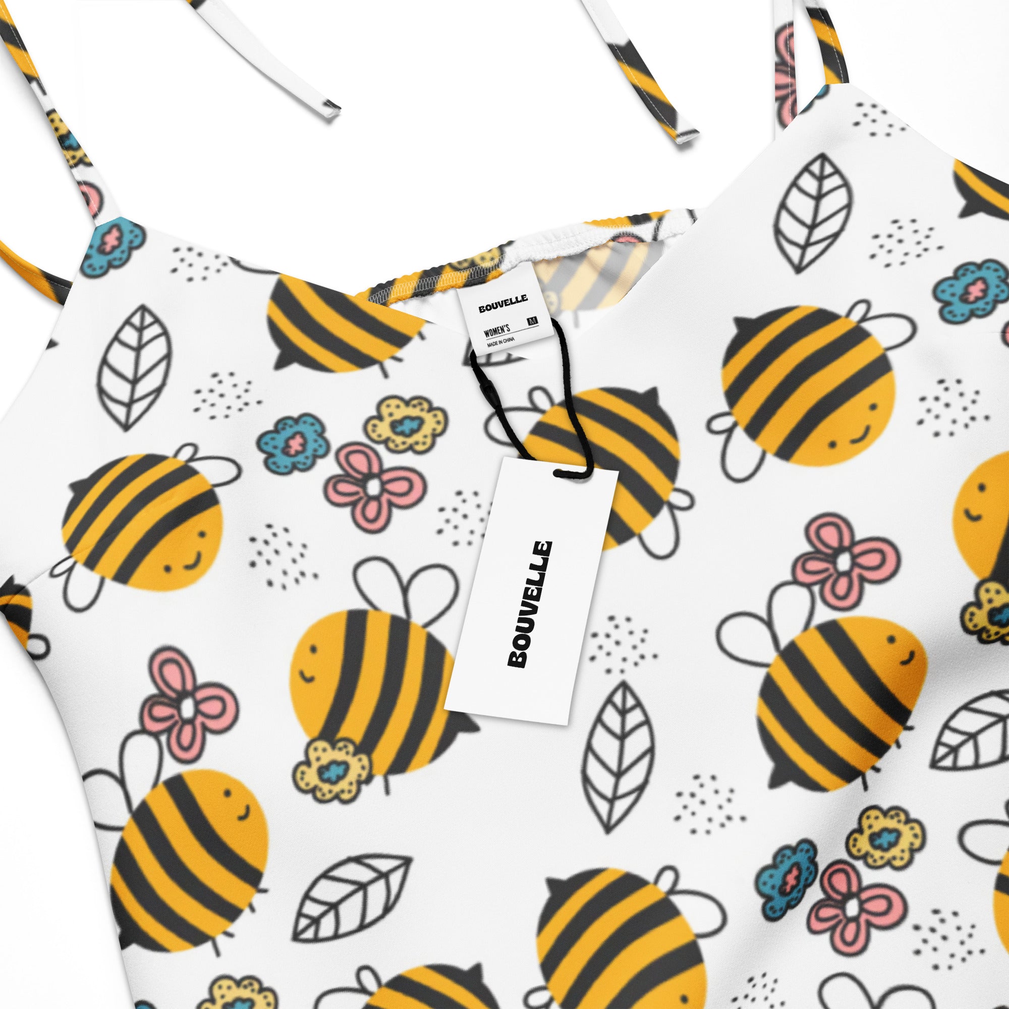 White spaghetti strap top with yellow and black bee, pink flower, and green leaf pattern for womens floral midi dress