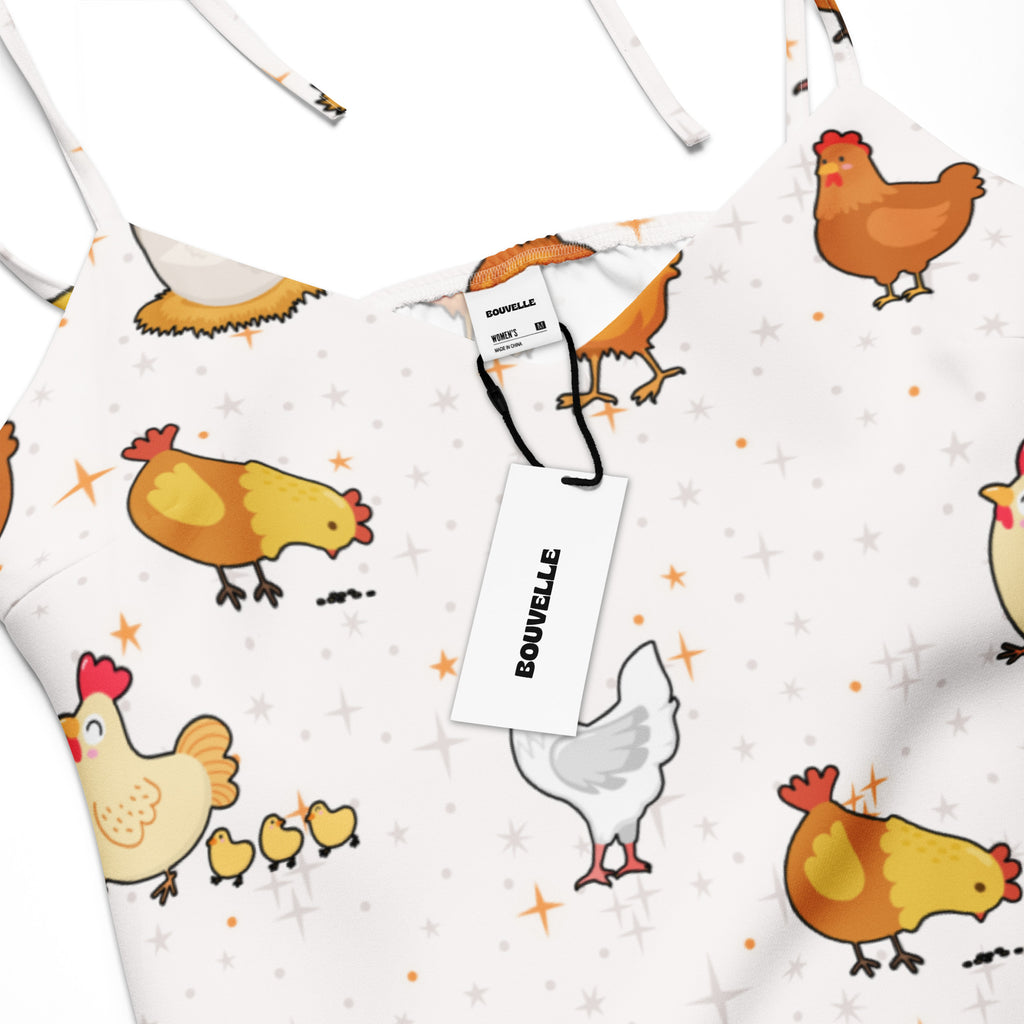White apron with cartoon chicken design and Bouvelle tag.