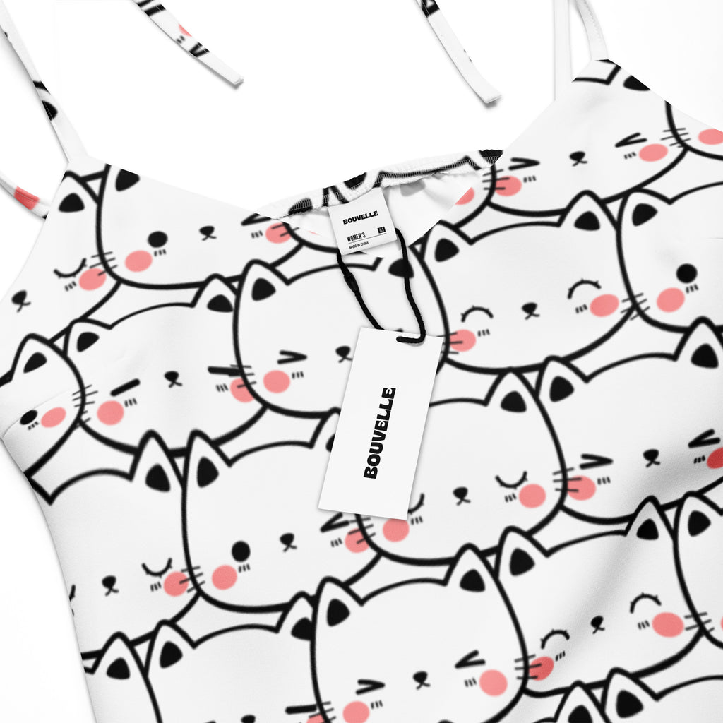 White spaghetti strap midi slip dress with adjustable tie straps and black outlined cartoon cat print with pink cheeks