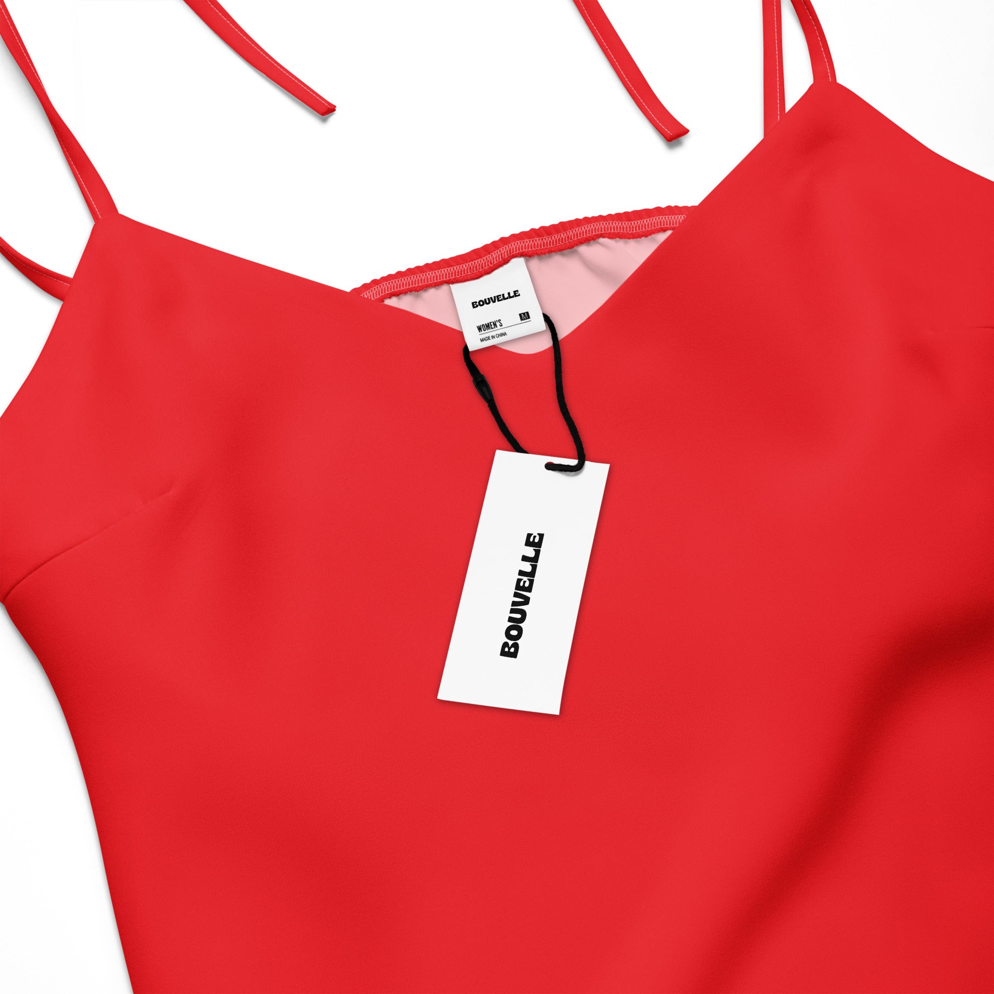 Red dress with a visible brand tag on a white background