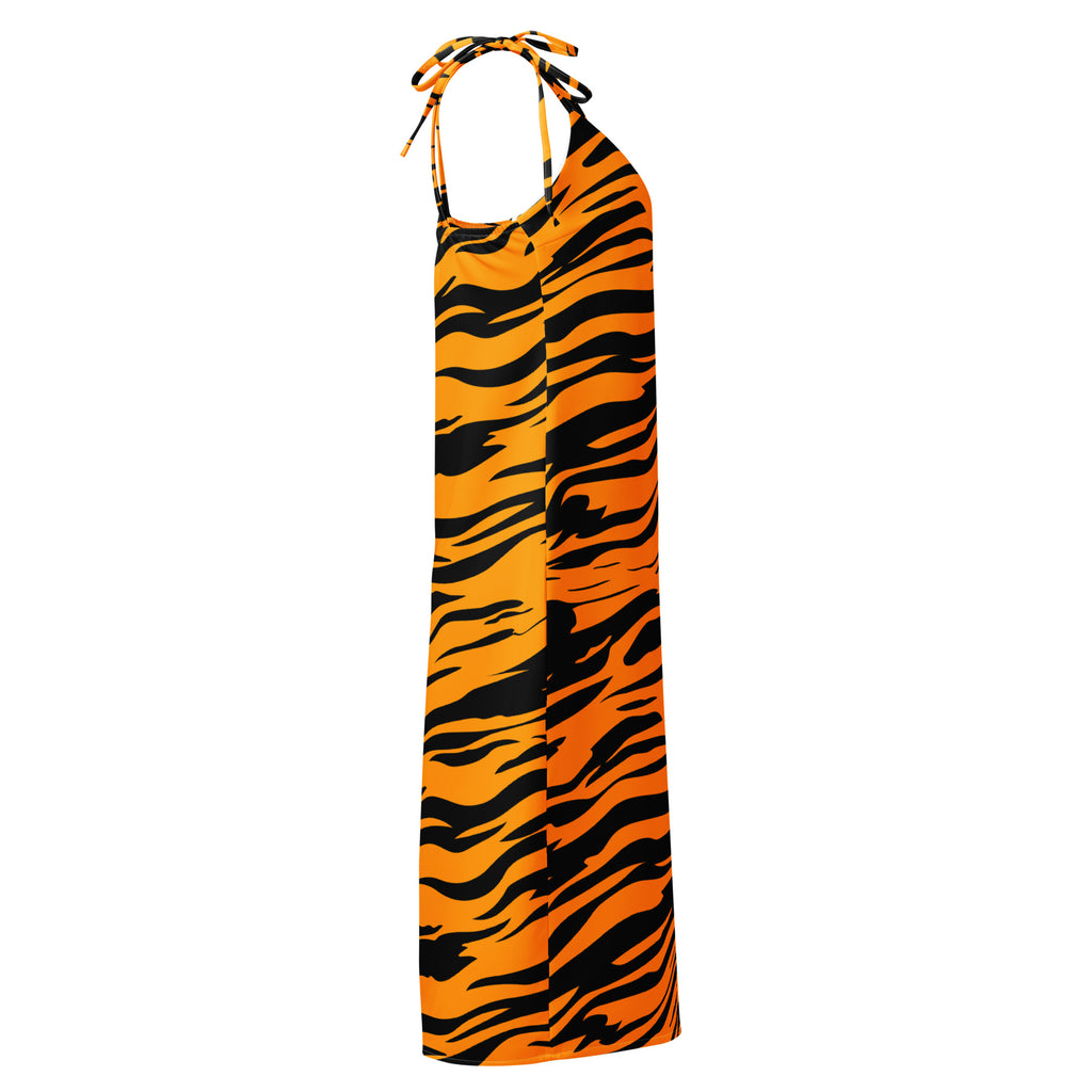 A vibrant orange and black tiger stripe halter neck maxi dress with flowing lightweight fabric and adjustable tie straps