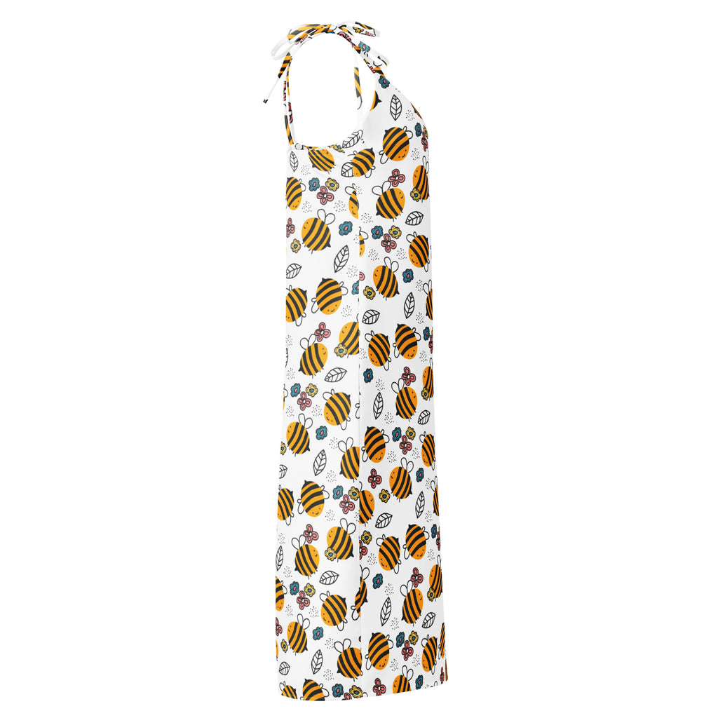 White halter-neck midi slip dress with yellow bumblebee print green leaves small flowers and adjustable tie straps