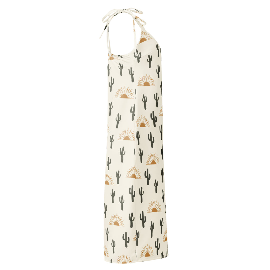 Cream-colored women’s desert cactus sunrise slip midi dress with adjustable tie straps and black cactus golden sunsets pattern
