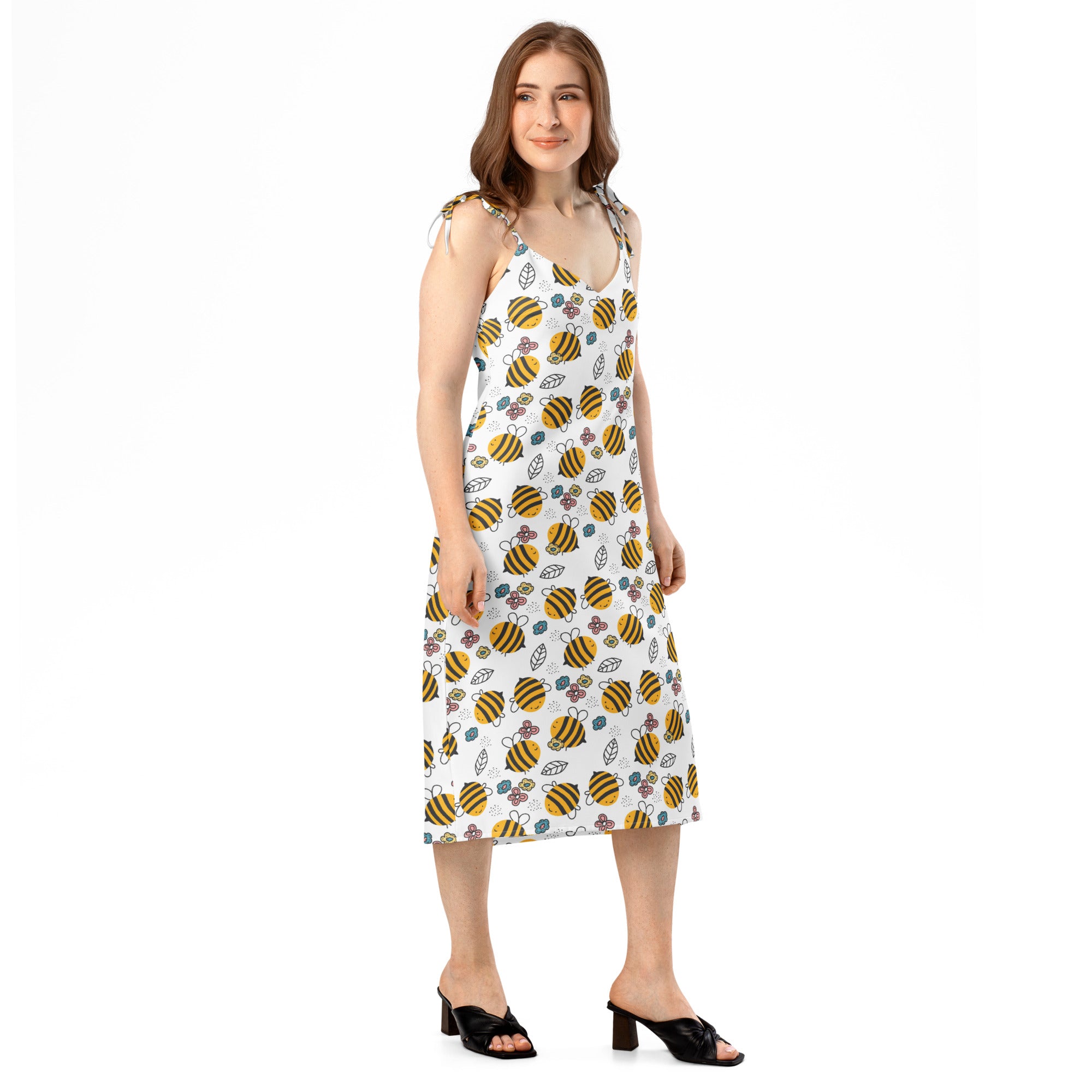 White sleeveless midi dress with yellow and black bumblebee floral pattern adjustable tie straps and built in bra