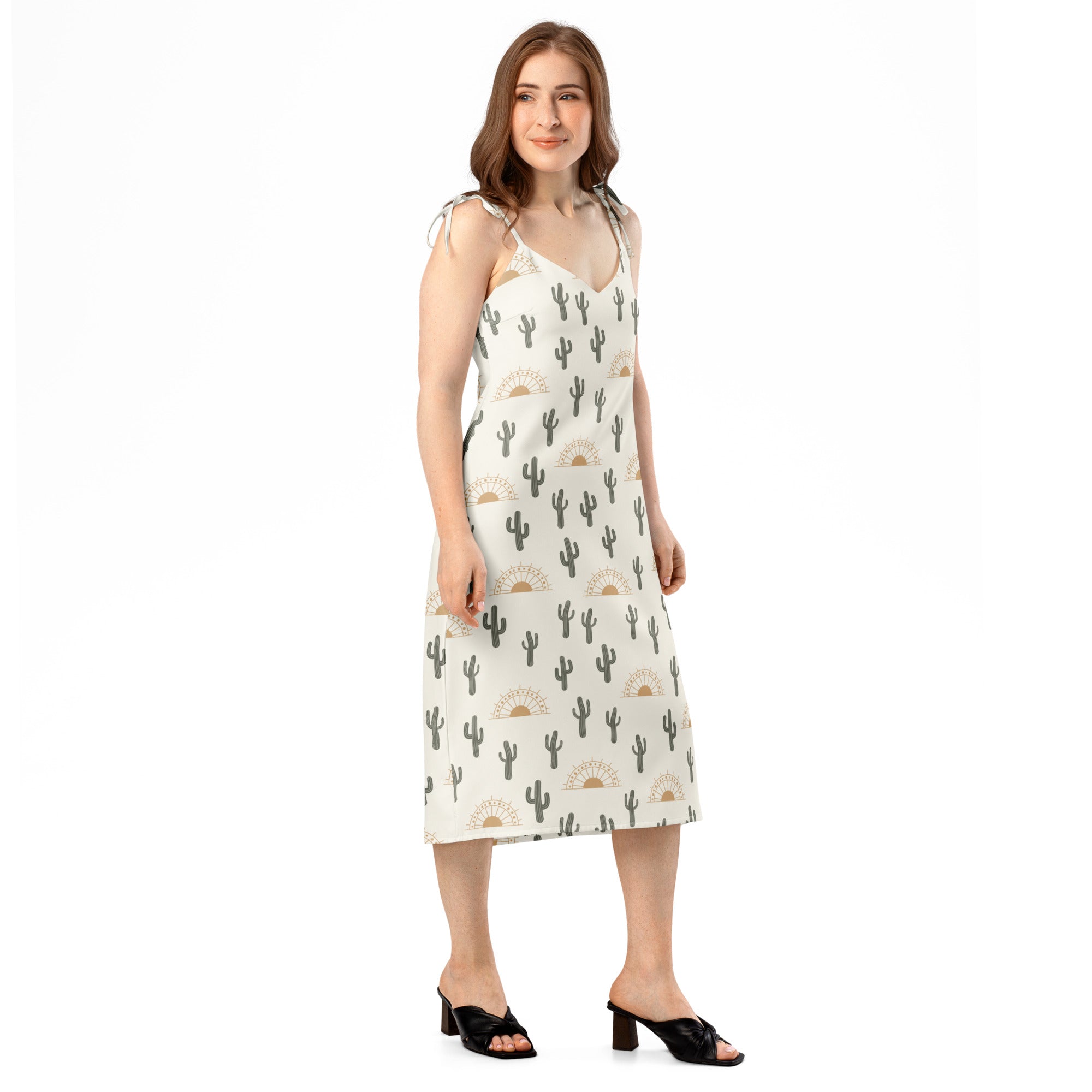 Women’s off-white midi slip dress with black cactus and beige sunburst pattern featuring adjustable tie straps and built-in bra